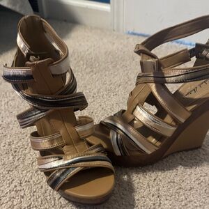 Michael Antonio Tan and Black Strappy Wedges